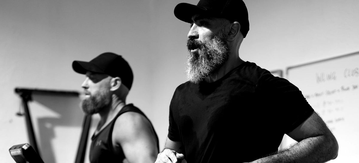Two members training side by side at Desert Barbell strength gym in Dubai