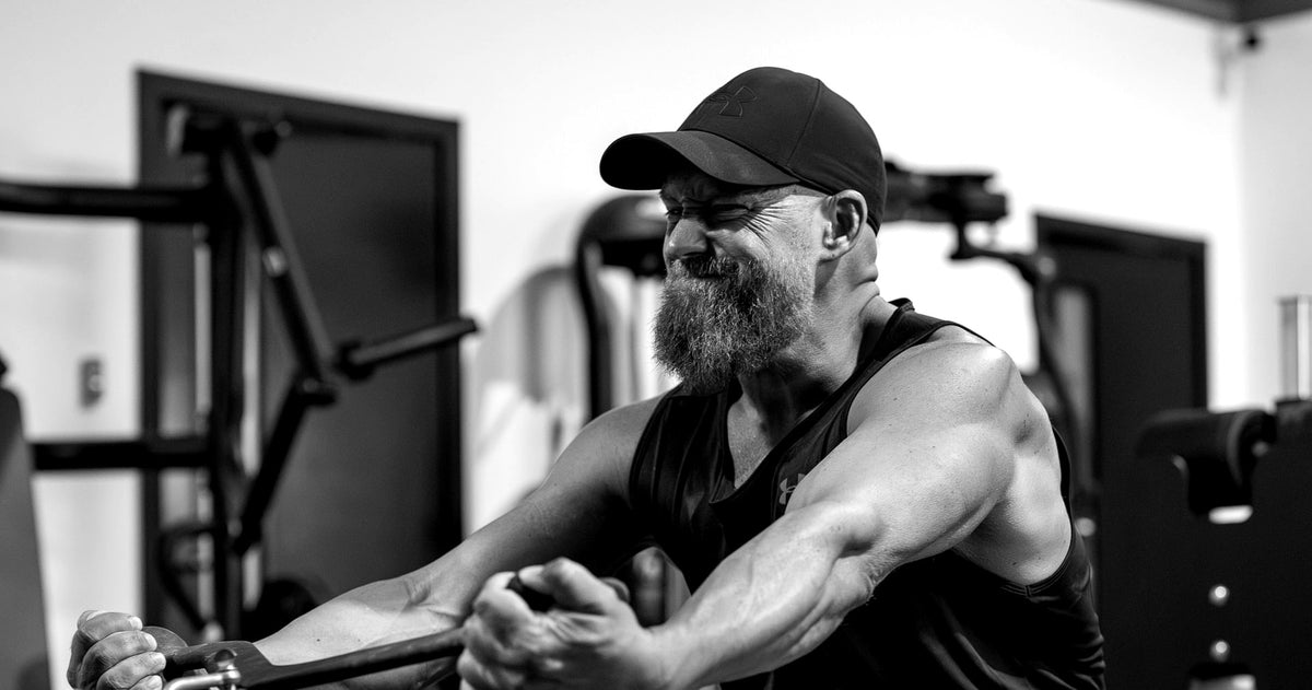 Masters athlete training on a rowing machine at Desert Barbell strength gym in Dubai